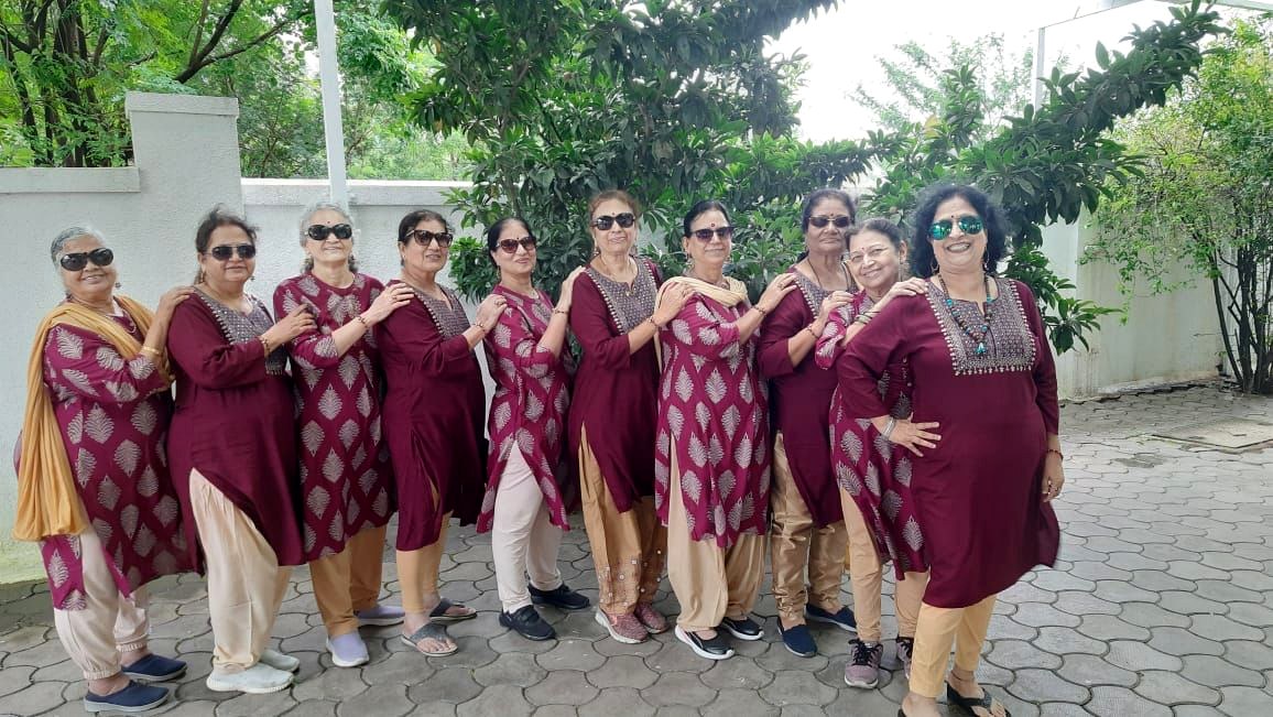 Group of senior women in matching kurtas with sunglasses — 60s feel like 16