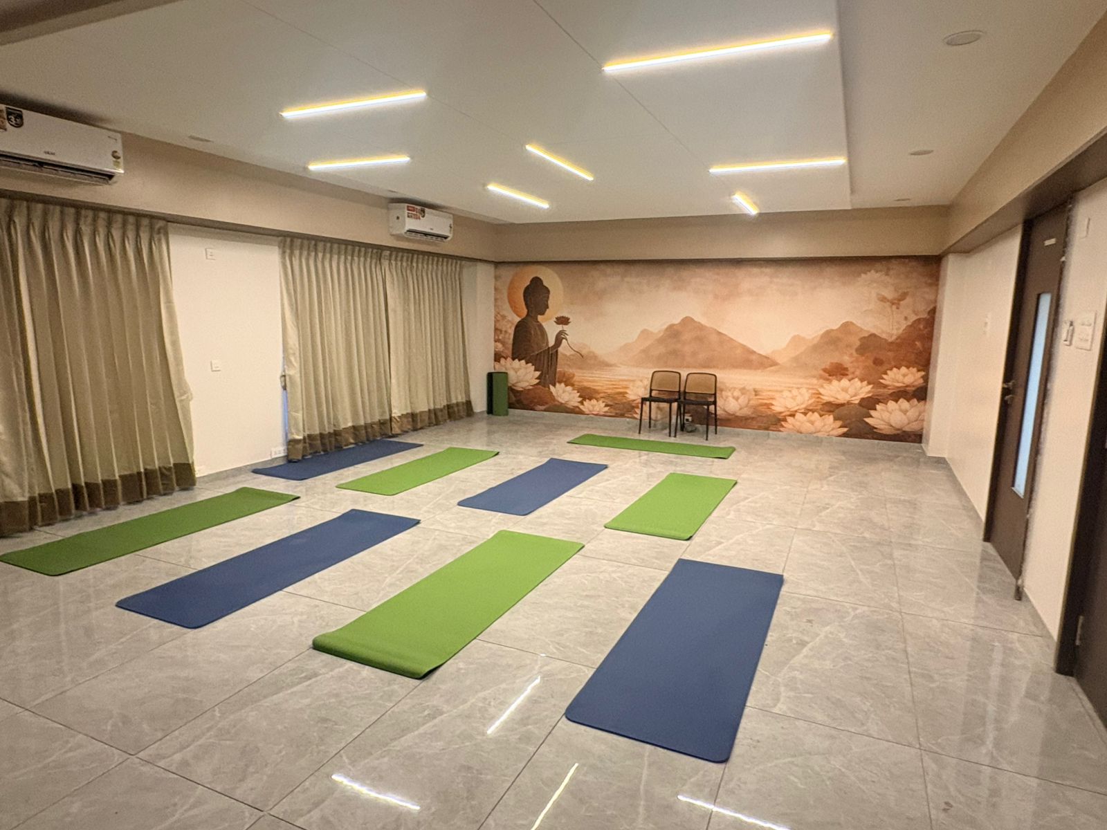 Warm, plant-filled reception of the Nisarg Chhaya Health & Wellness Center